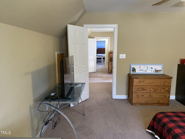 carpeted bedroom featuring ceiling fan and vaulted ceiling