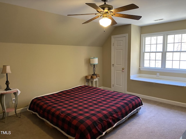 carpeted bedroom featuring lofted ceiling and ceiling fan