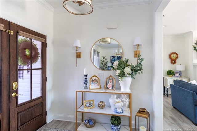 entryway featuring light hardwood / wood-style floors and crown molding