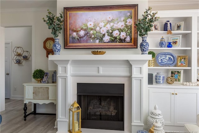 interior details with hardwood / wood-style floors and ornamental molding