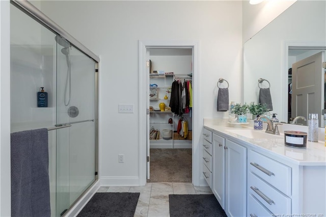 bathroom with vanity and walk in shower