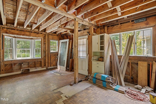 miscellaneous room featuring parquet floors and a wealth of natural light