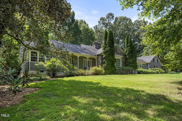 ranch-style home with a front lawn