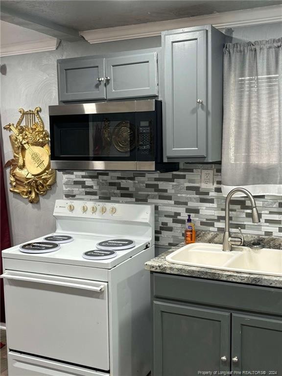 kitchen featuring gray cabinetry, white electric range, decorative backsplash, and sink