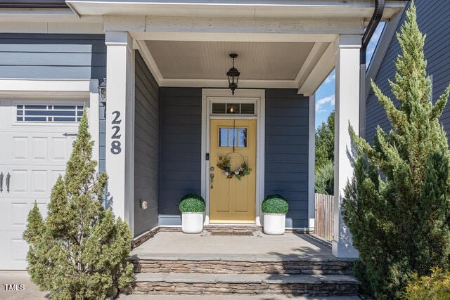 doorway to property with a garage