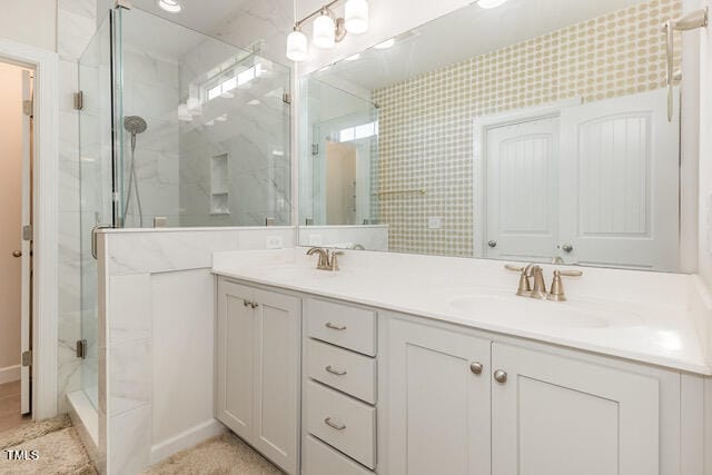 bathroom with vanity and a shower with shower door