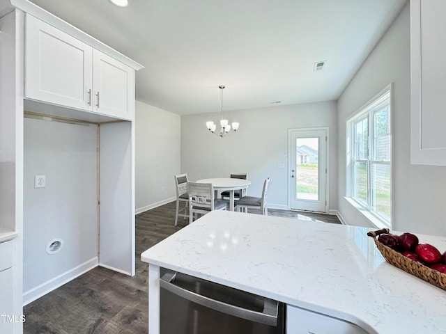 kitchen with visible vents, a chandelier, white cabinetry, light stone countertops, and dark wood-type flooring