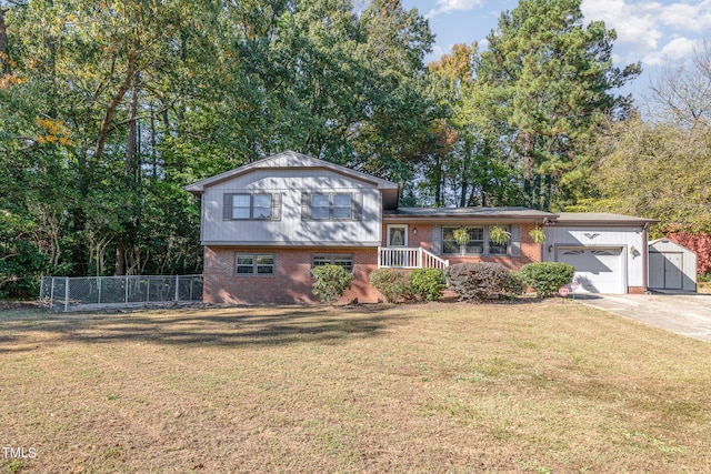 split level home featuring a front yard and a garage