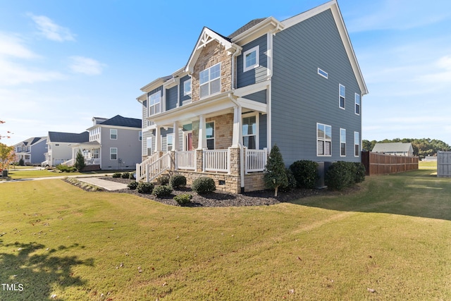 view of front facade featuring a front lawn and a porch