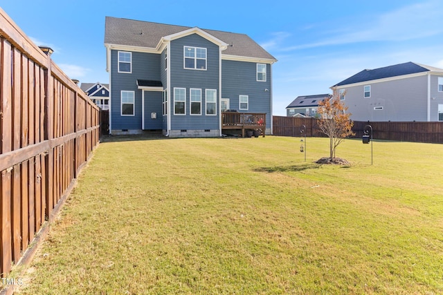 rear view of property featuring a yard