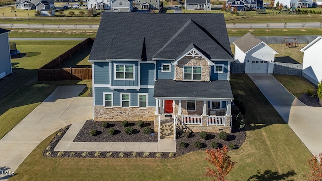 view of front facade with a garage and a porch