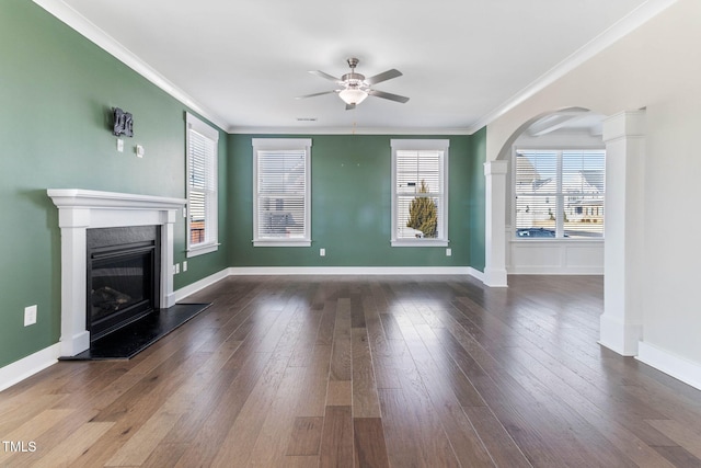 unfurnished living room with ceiling fan, crown molding, and hardwood / wood-style floors