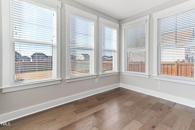 unfurnished sunroom featuring plenty of natural light