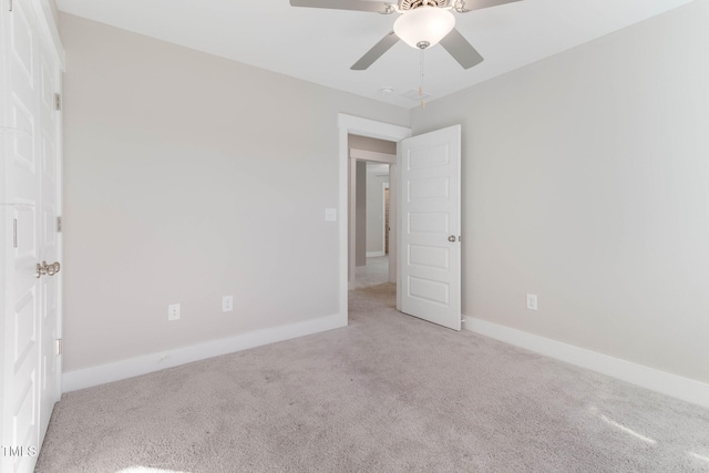 empty room with light carpet and ceiling fan