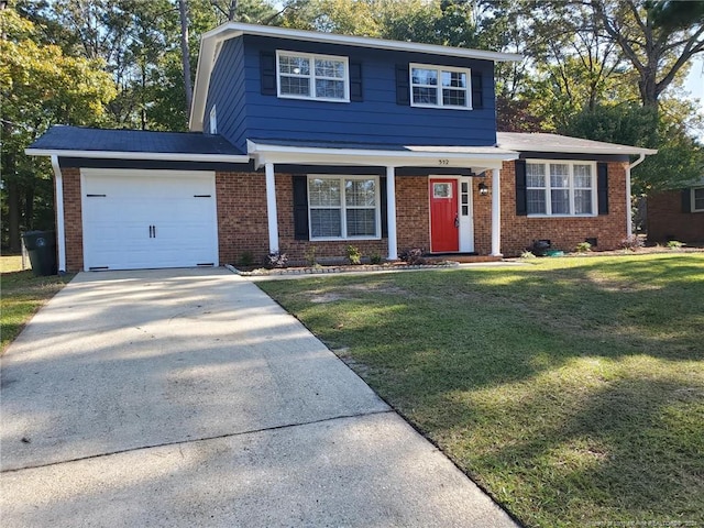 view of front of property with a front lawn and a garage