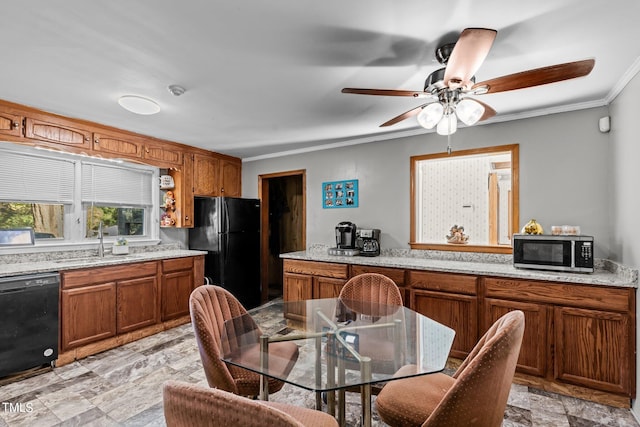 kitchen with black appliances, sink, ceiling fan, light stone counters, and ornamental molding