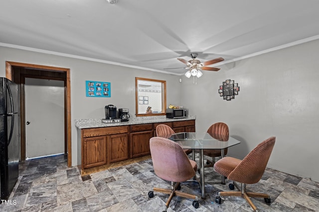 dining room featuring ceiling fan and ornamental molding