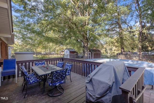 deck featuring a storage shed