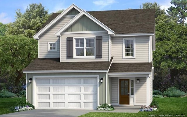 view of front of property featuring a front yard and a garage