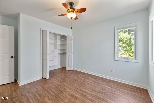 unfurnished bedroom with a closet, wood-type flooring, and ceiling fan