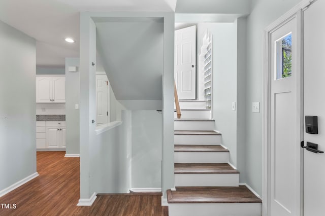 stairway featuring hardwood / wood-style floors