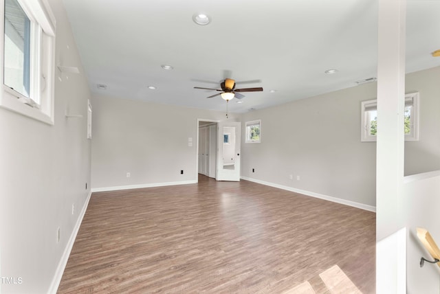 empty room featuring ceiling fan and hardwood / wood-style floors