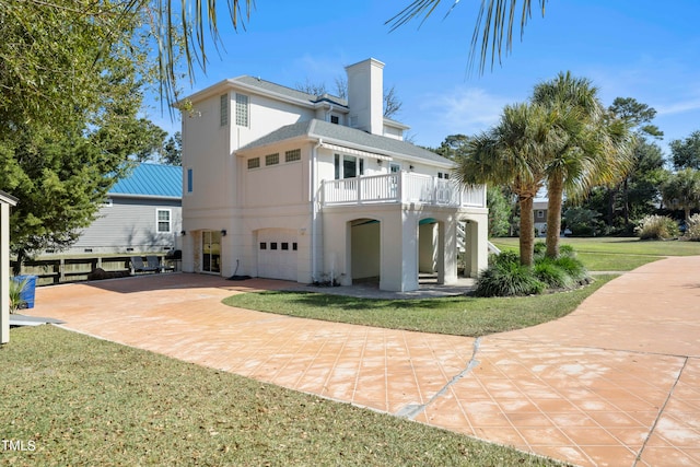 rear view of property with a yard