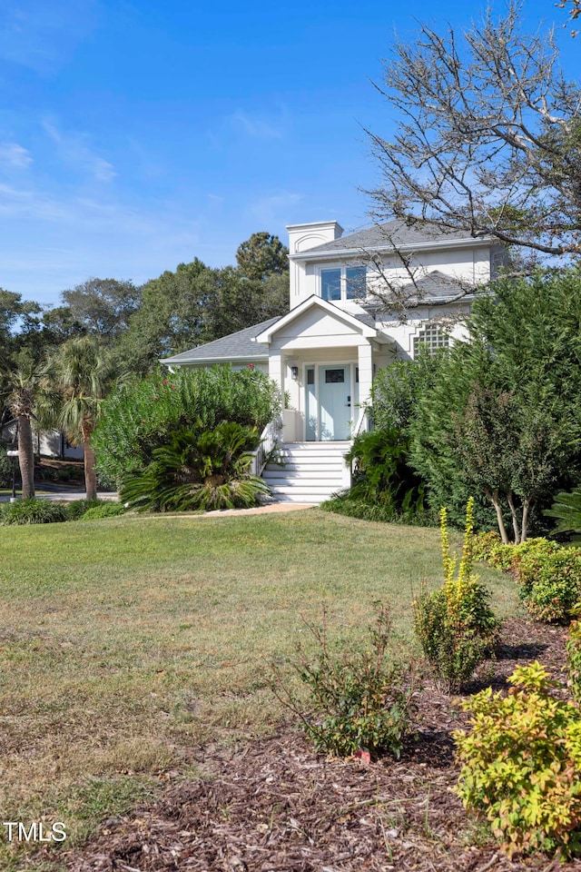 view of side of property featuring a yard