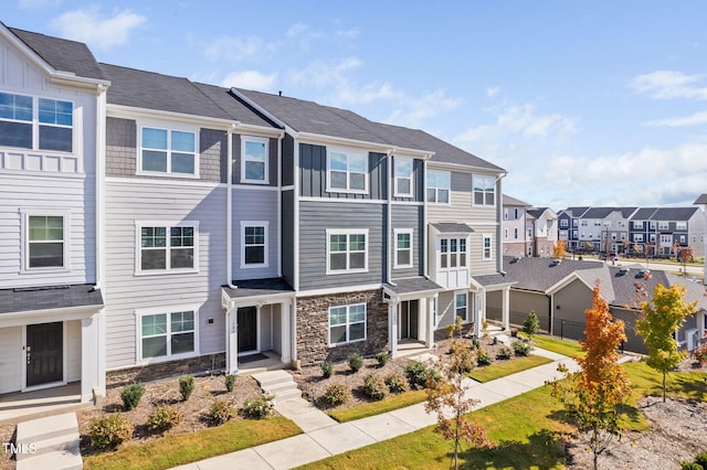 view of property featuring a front yard