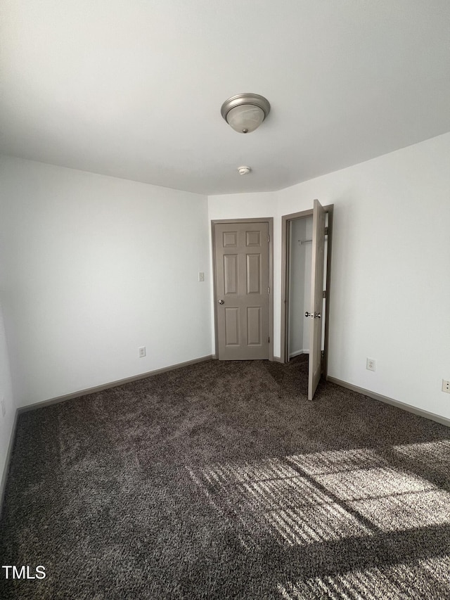 unfurnished bedroom with carpet flooring