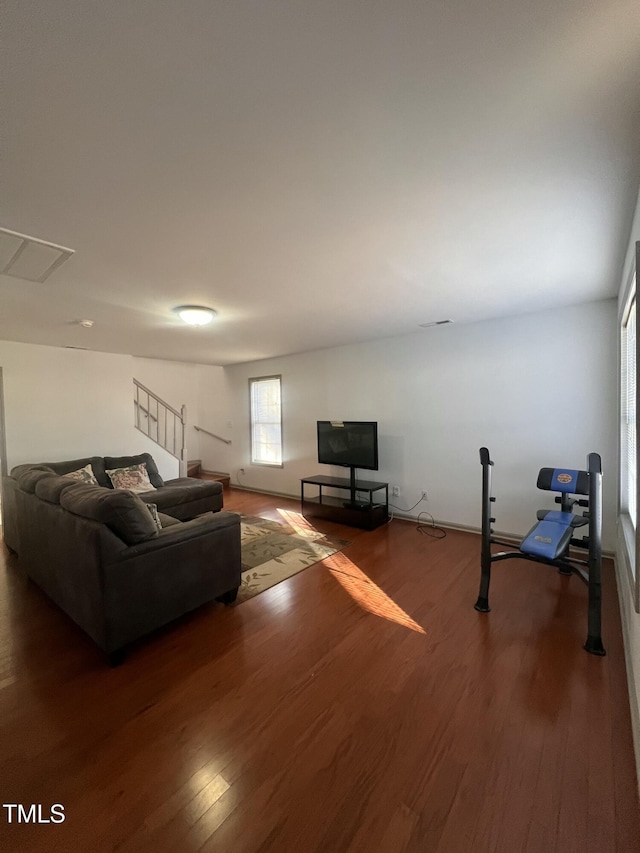 living room with dark hardwood / wood-style flooring