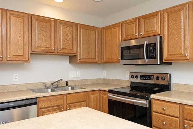 kitchen featuring appliances with stainless steel finishes and sink