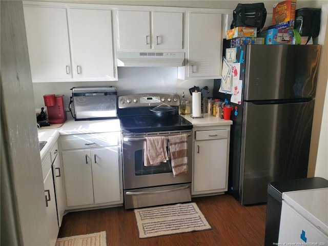 kitchen with appliances with stainless steel finishes, white cabinetry, and dark hardwood / wood-style flooring