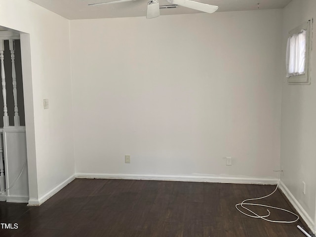 empty room with dark hardwood / wood-style floors