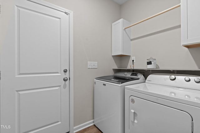 laundry room with cabinets and independent washer and dryer