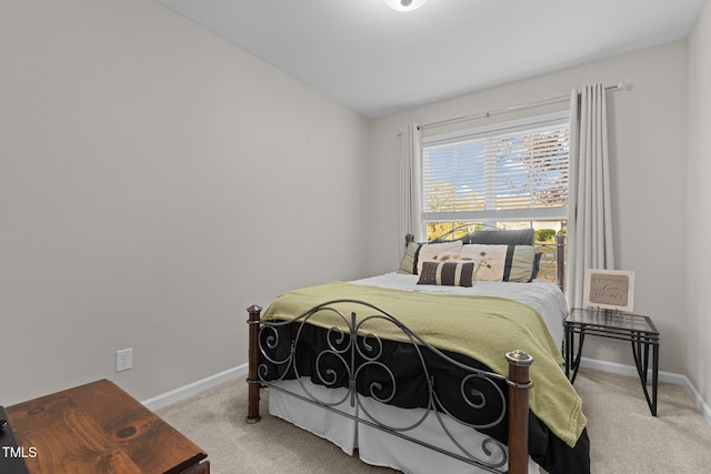 bedroom featuring light colored carpet