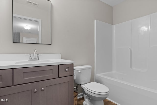 full bathroom with shower / bathing tub combination, vanity, toilet, and wood-type flooring