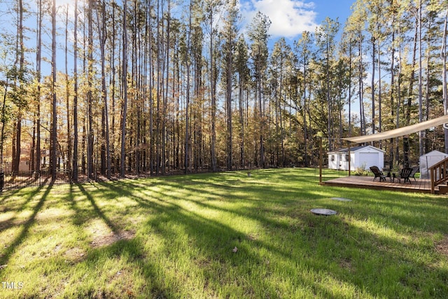 view of yard featuring a wooden deck