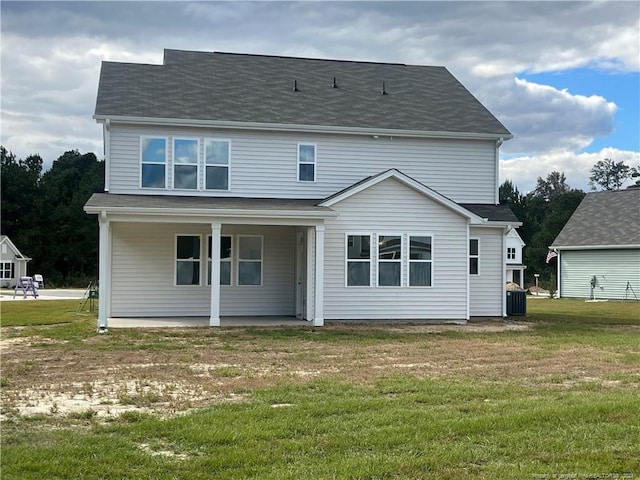 back of house with a yard