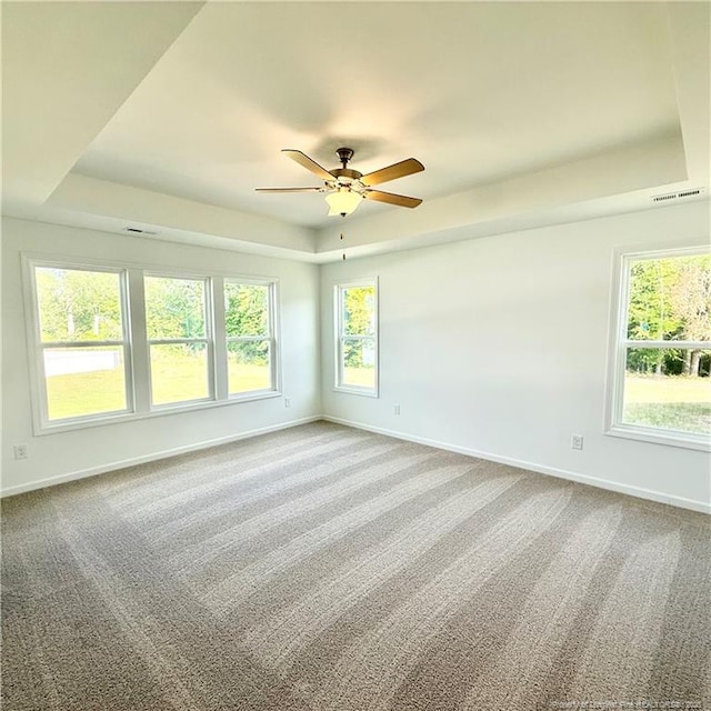 145 Cahill, Home, Raeford, NC 28376 - carpeted empty room with a tray ceiling, baseboards, and a ceiling fan
