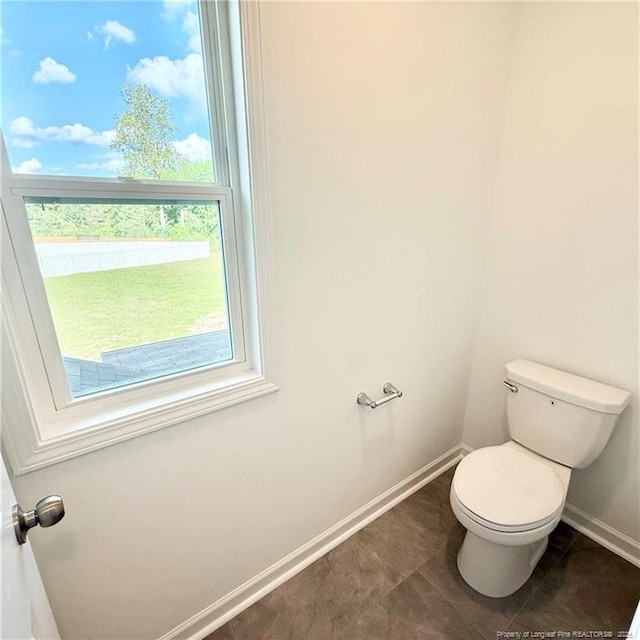 145 Cahill, Home, Raeford, NC 28376 - bathroom featuring baseboards, toilet, and tile patterned floors