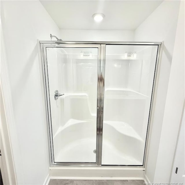 145 Cahill, Home, Raeford, NC 28376 - bathroom with a stall shower and baseboards
