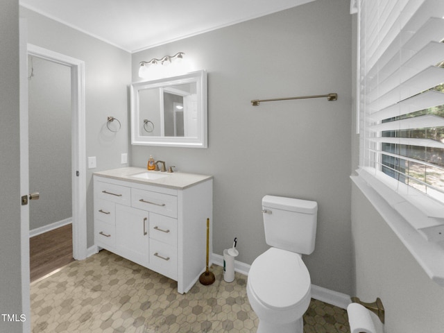 bathroom with vanity and toilet