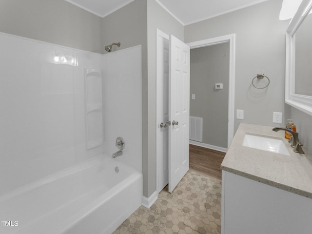 bathroom featuring vanity, tub / shower combination, and tile patterned flooring