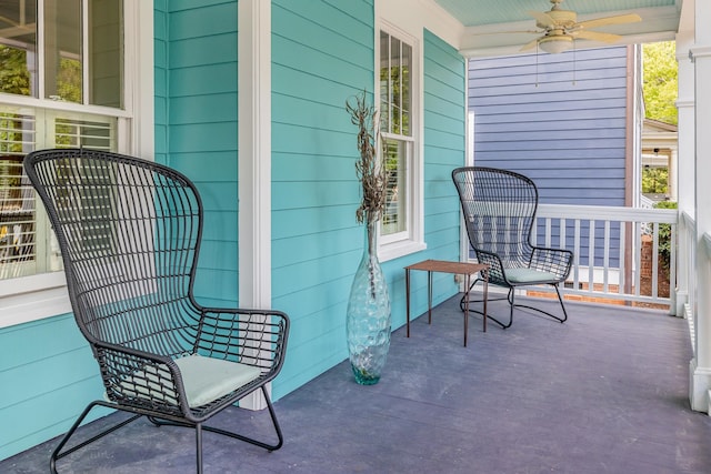 exterior space with ceiling fan and a porch