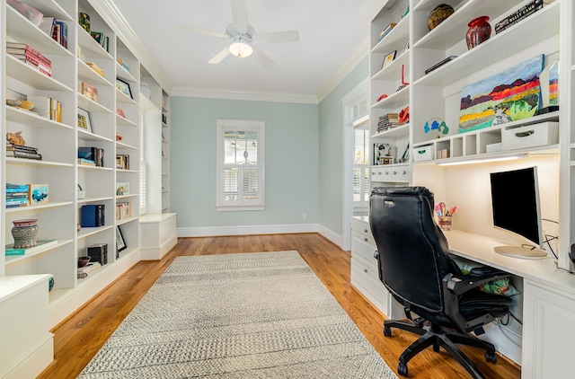 office area with ornamental molding, light wood-type flooring, and ceiling fan