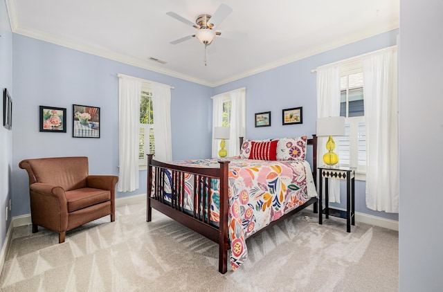 bedroom with crown molding, light carpet, and ceiling fan