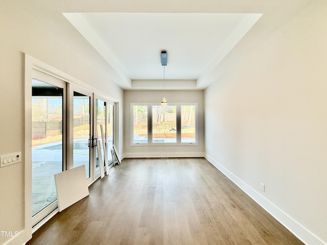 spare room with french doors and hardwood / wood-style floors