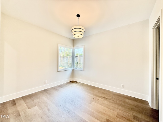 empty room with light wood-type flooring