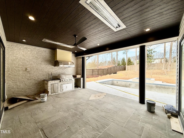 view of patio / terrace featuring an outdoor kitchen, a grill, and ceiling fan